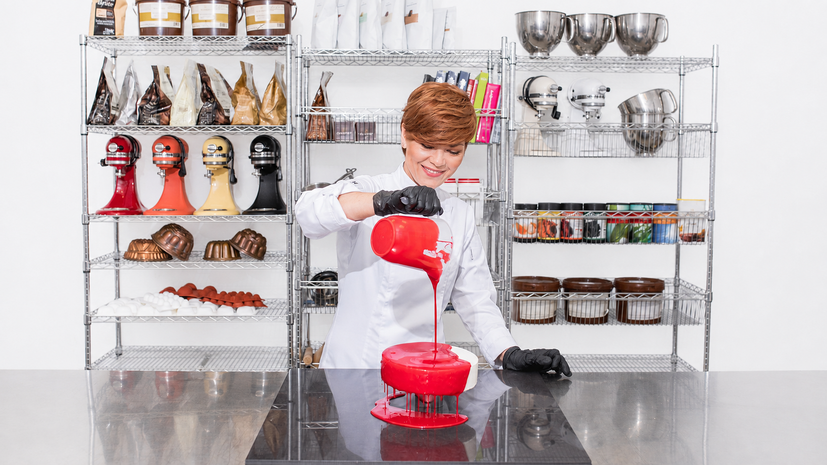 Chef Tanya Novak glazing a cake